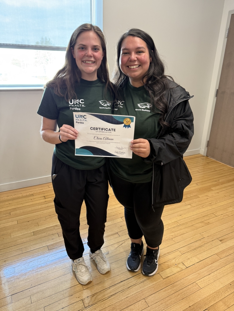 Clara with Audi holding her certificate