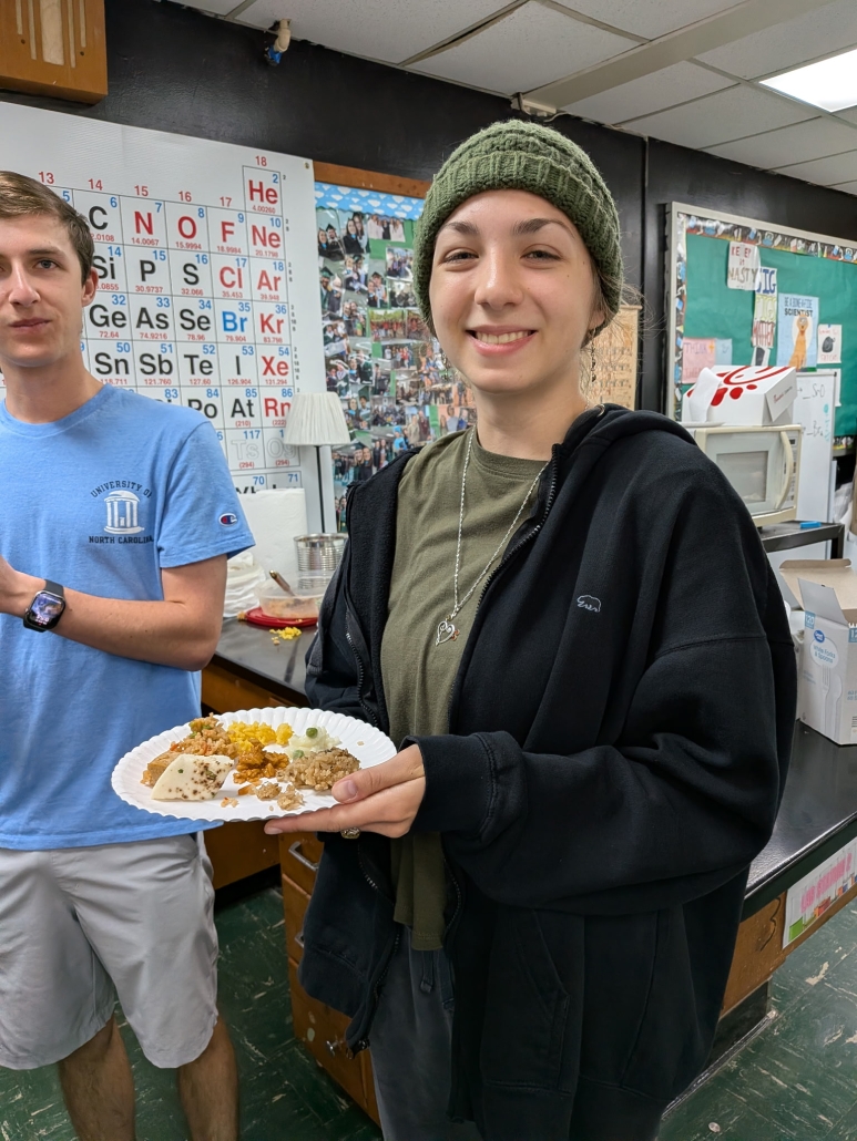 Natalie with plate of rice items in chem