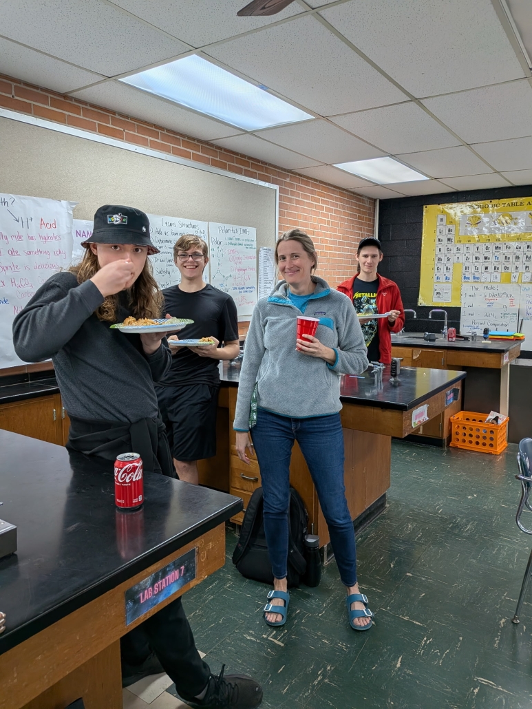 students and Ms. Williams enjoying Rice Day treats