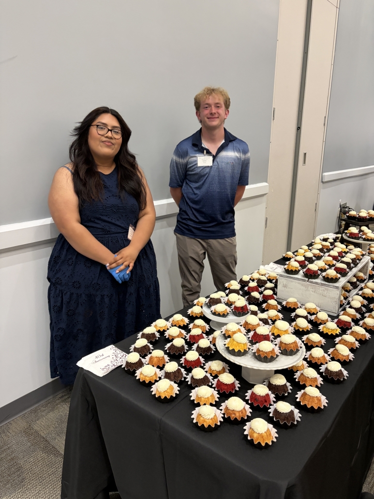 Shayla and TaaP student helping serve cupcakes