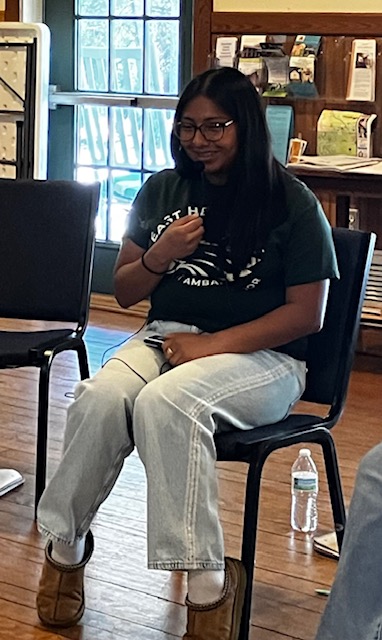 Arely in chair smiling