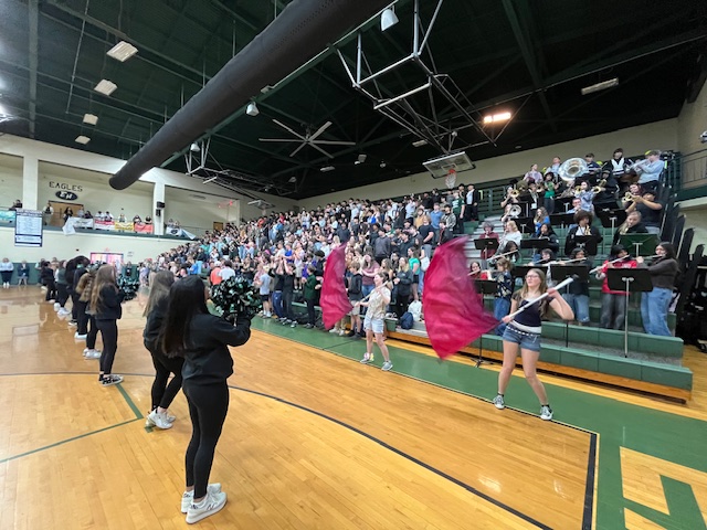 Cheerleaders and flags playing for the sophomores