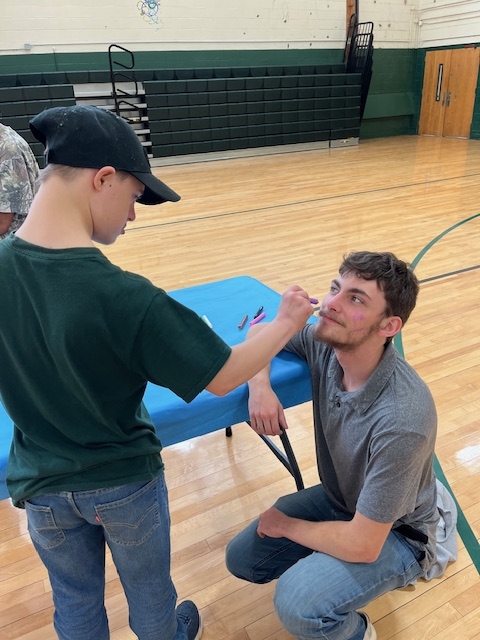 Hunter painting Blake's face