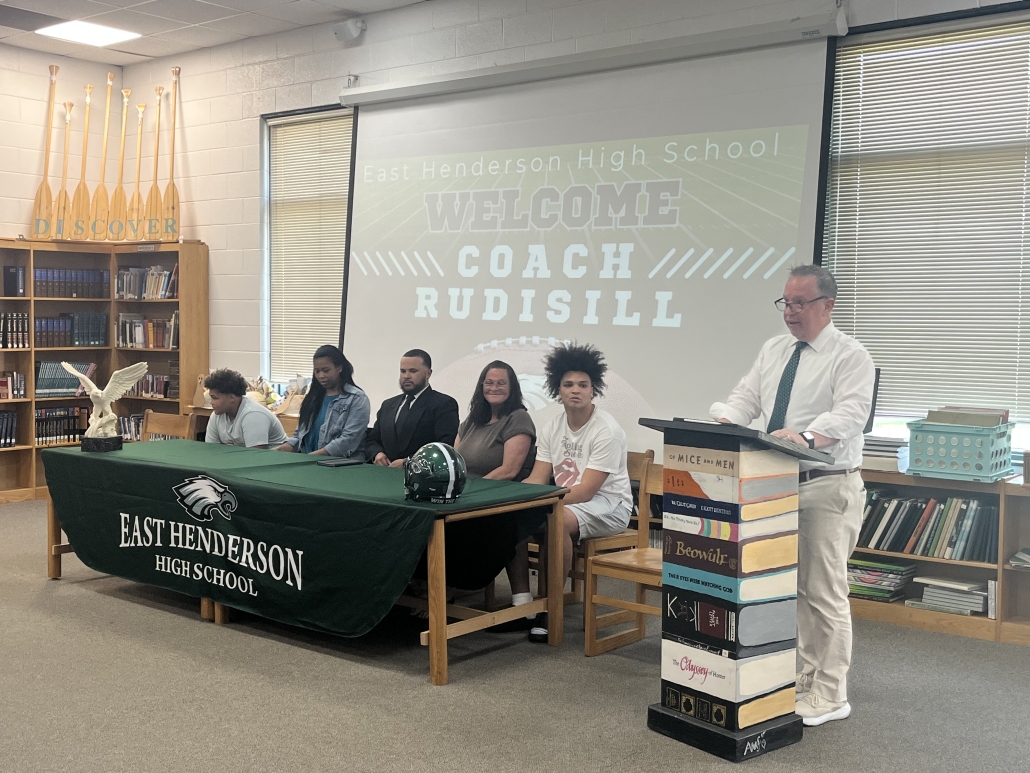 Mr. Scott speaking at podium
