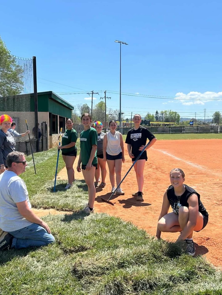 girls posing with tools