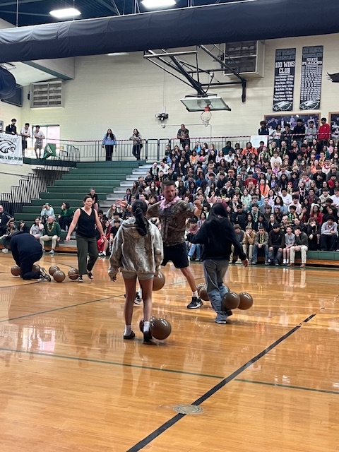 teachers and students playing pep rally balloon game