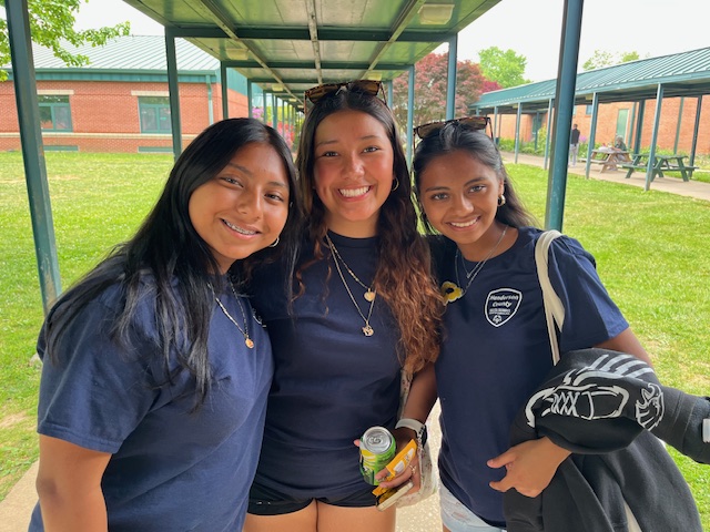 Arely, Diane and Natalia in volunteer shirts