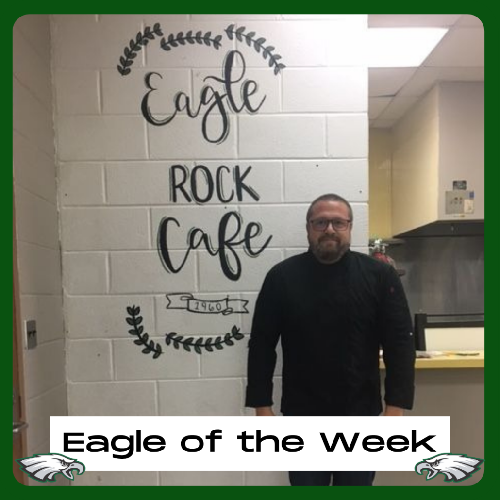 Chef Trey in front of Eagle Rock Cafe sign