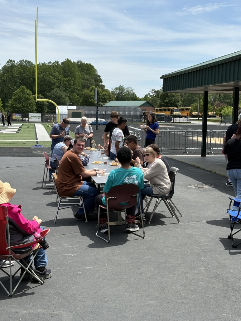 EEs and families sitting at table