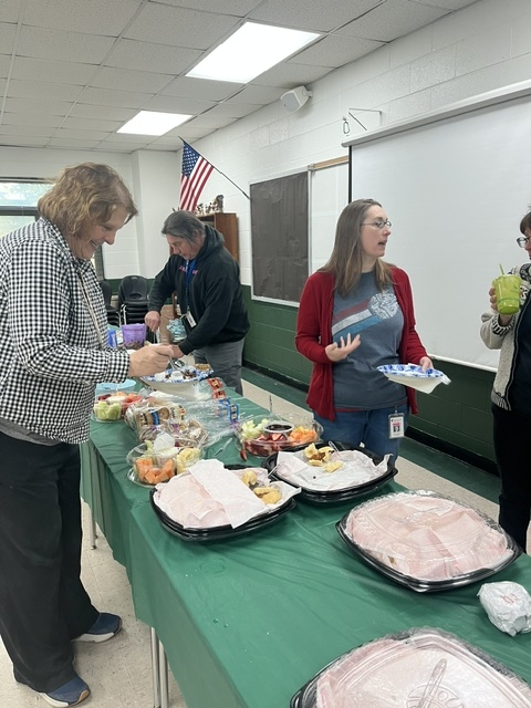 Teachers getting breakfast at a buffet