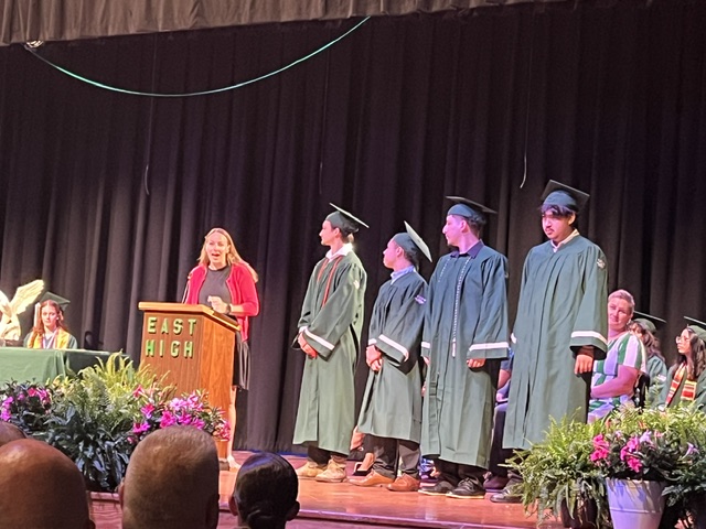 Mrs. Townsend with four apprenticeship graduates