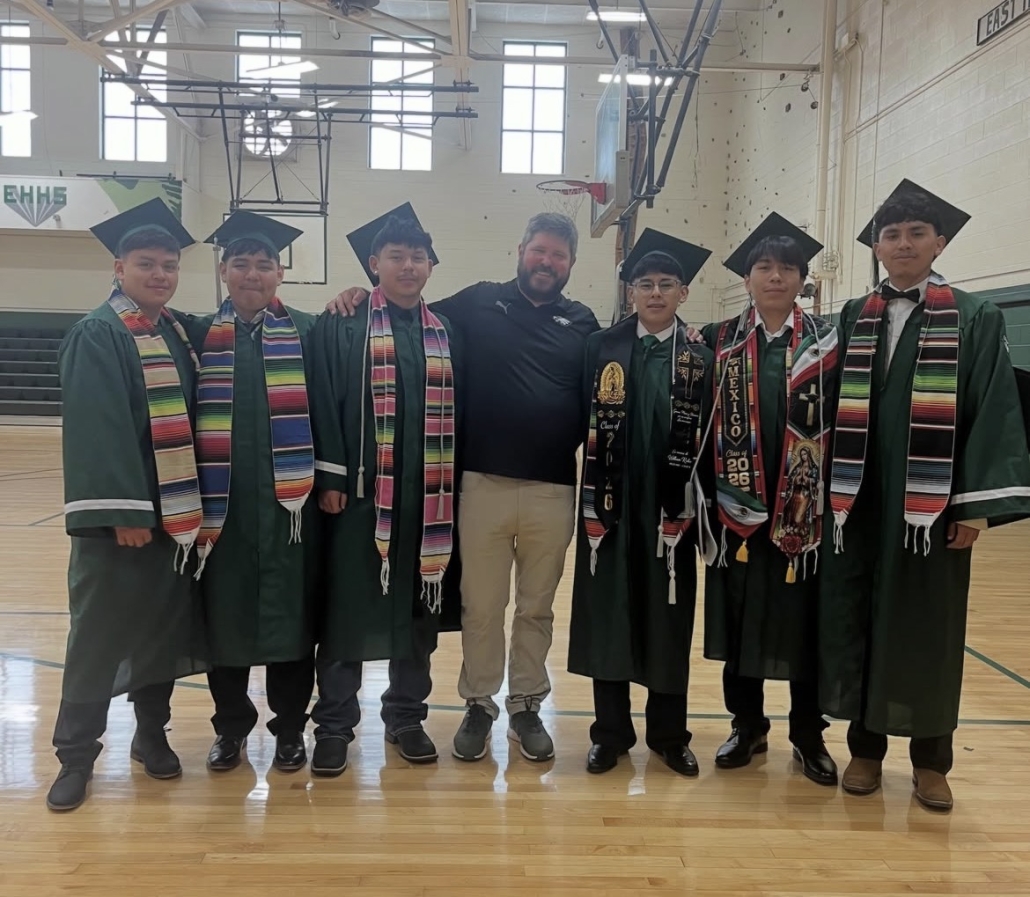 Coach Allman with soccer graduates