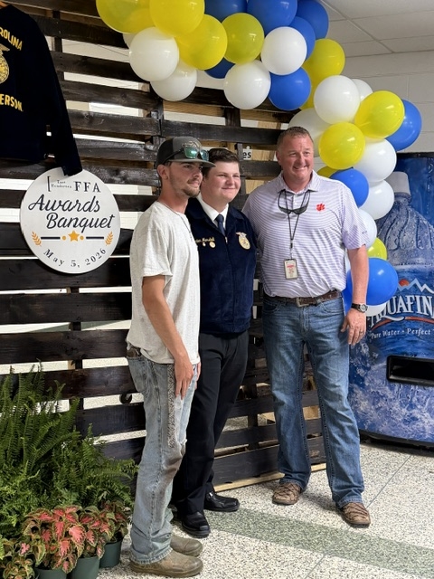 Rylan, Hunter & Mr. Rollins on backdrop