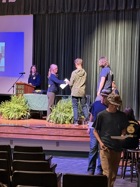 Steel receiving handshake on stage