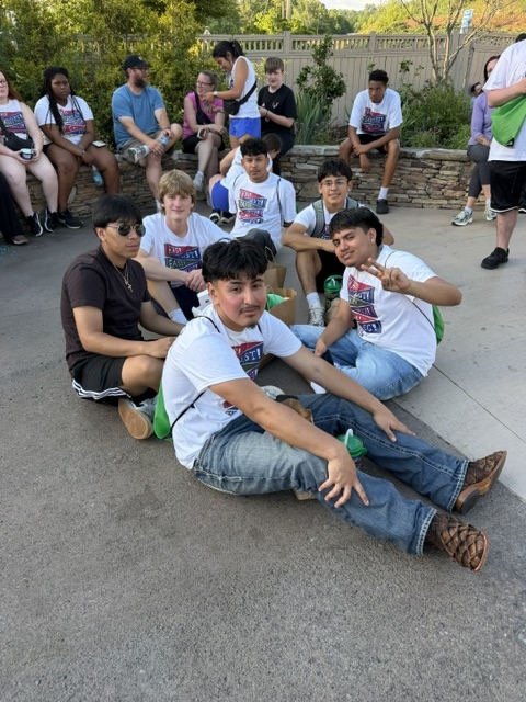 Group of boys waiting on the sidewalk