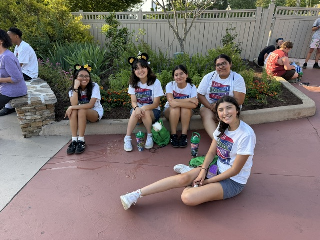 5 girls waiting for the bus