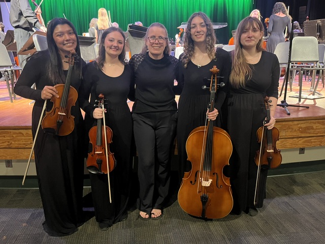 Mrs. Quinn with senior orchestra members
