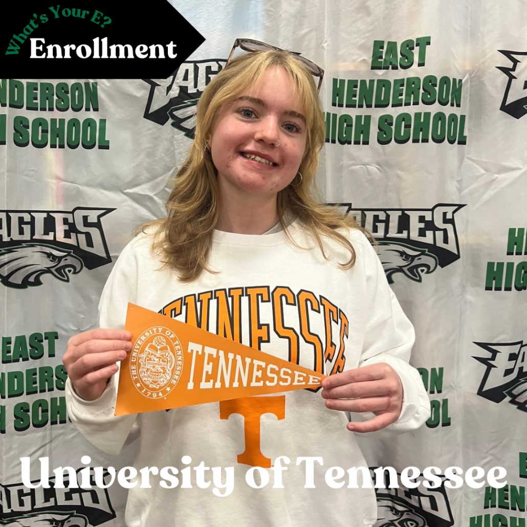 Julia holding pennant in enrollment photo