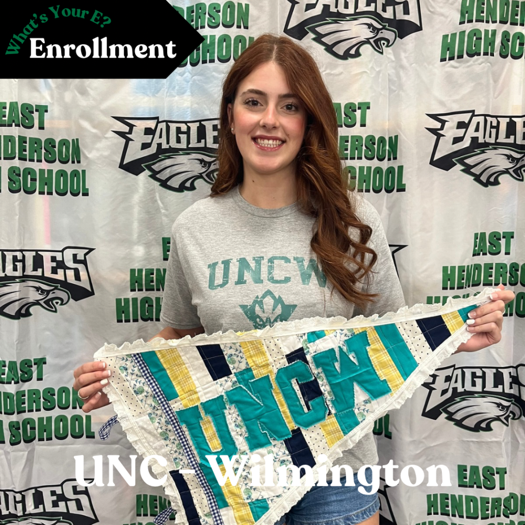 Cora holding quilted pennant in enrollment photo
