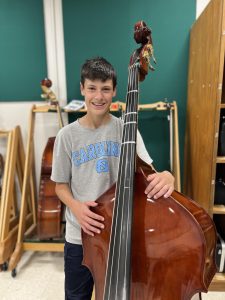 Photo of Logan with his Instrument