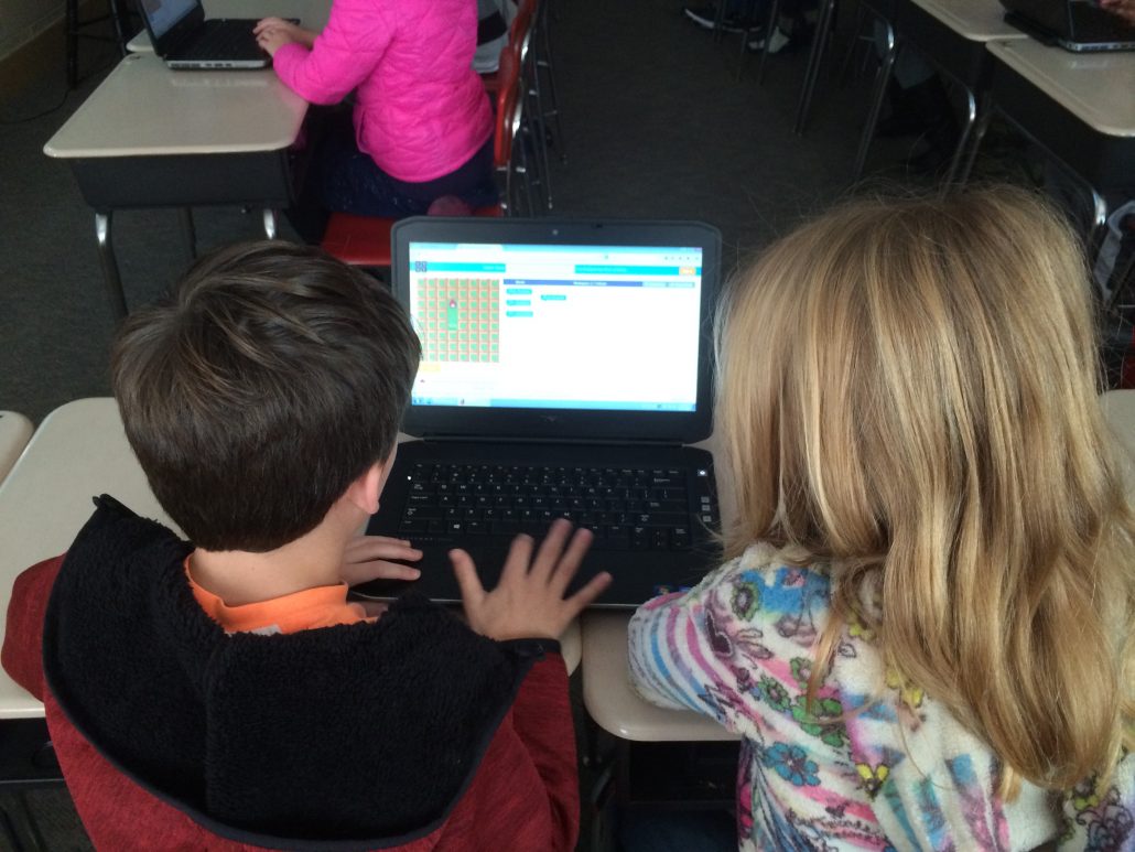 2 students at a Chromebook participating in the Hour of Code