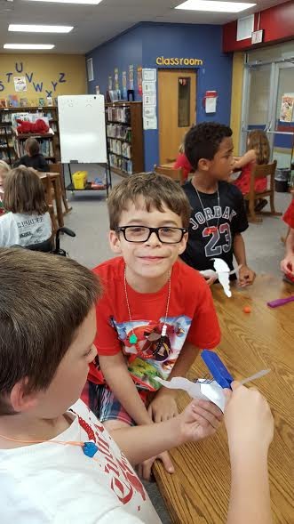 Students making airplanes