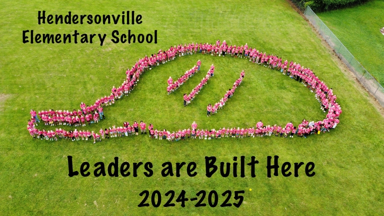 Image of student body forming a Construction Hat shape