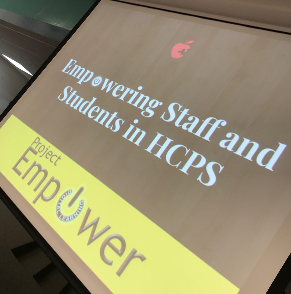 Computer Screen reading: Empowering Staff and Students in HCPS (includes Project Empower Logo)