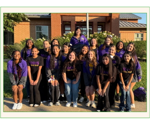 image of dance students standing Infront of a building 