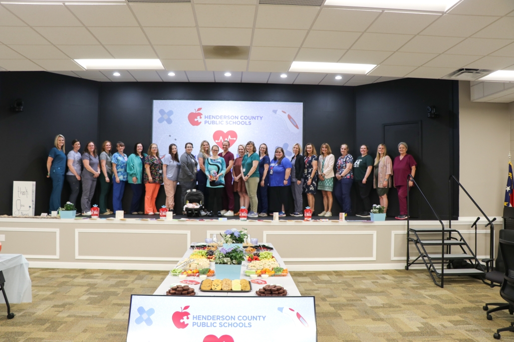 HCPS school nurses pose for a photo. There are about 25 people in the photo.