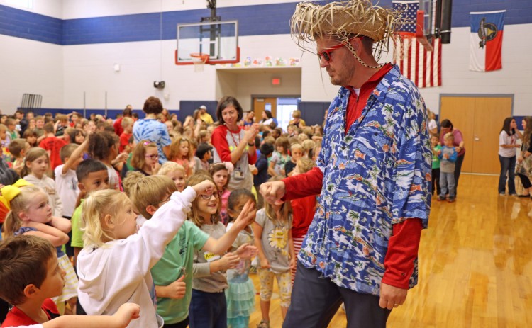 Chad Auten fistbumps student