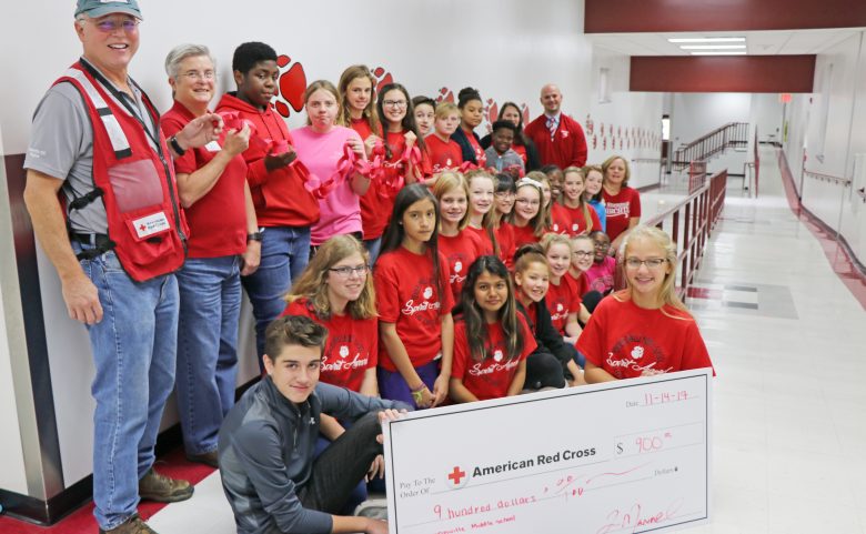 Hendersonville Middle students with oversized check