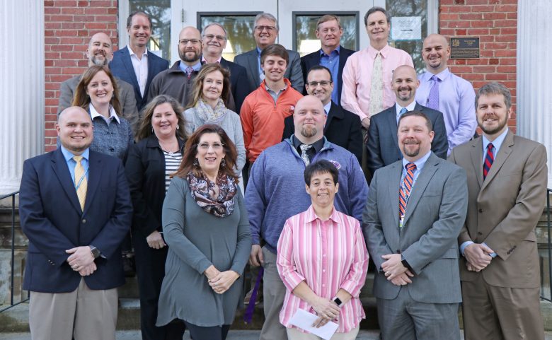 School administrators with Henderson Oil Company executives.