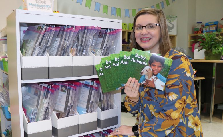 Kindergarten teacher with books