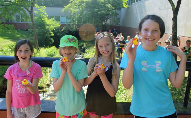 Students with rubber ducks.