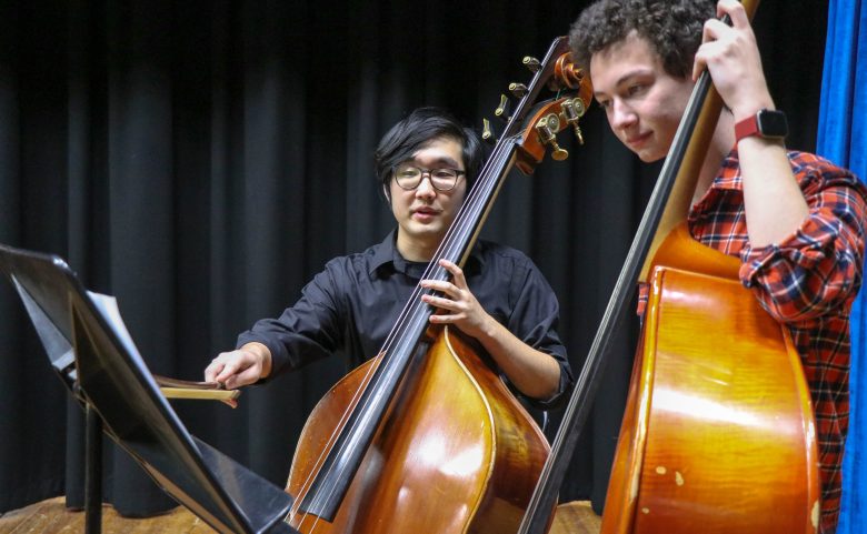 Students and upright basses