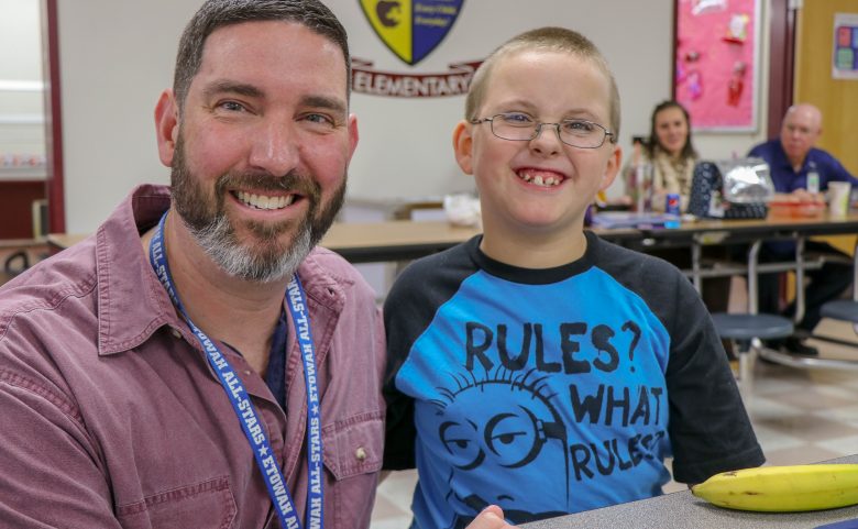 Bus driver David Jacklin and a student in cafeteria