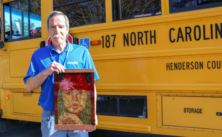 Bus driver Gary Kutch with a piece of his artwork