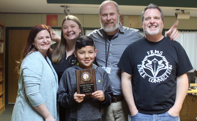 Teachers with spelling bee champ