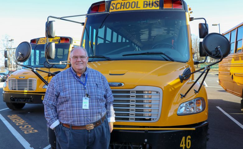 Bus driver Phil Winchester outside his bus