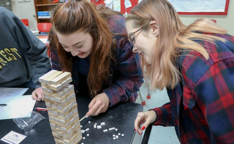 Students play Jenga