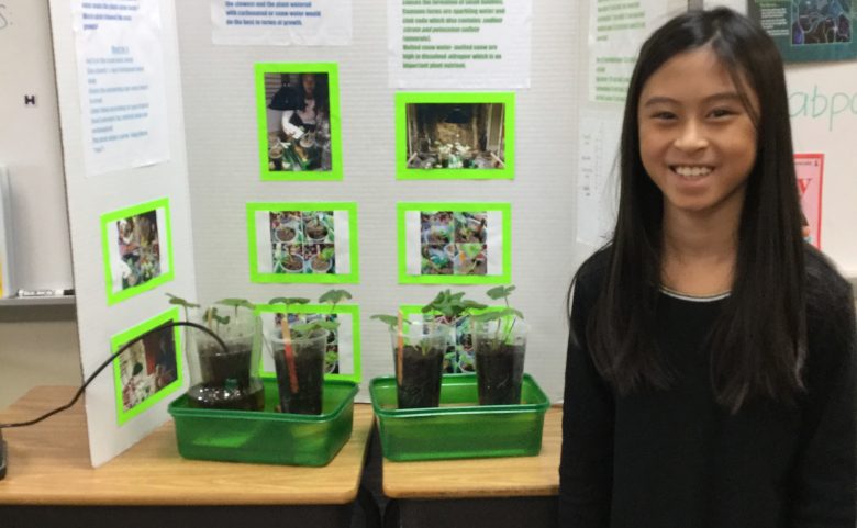 student with science project display board