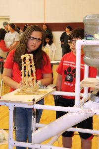 2 students building tower