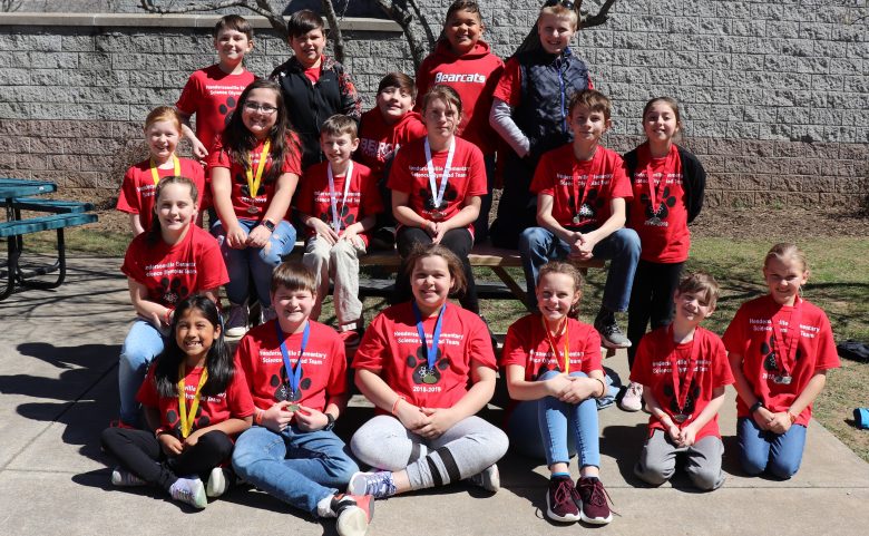 group of students with medals