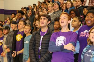 large group of students cheering in gym