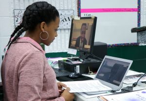 female student video chatting with composer