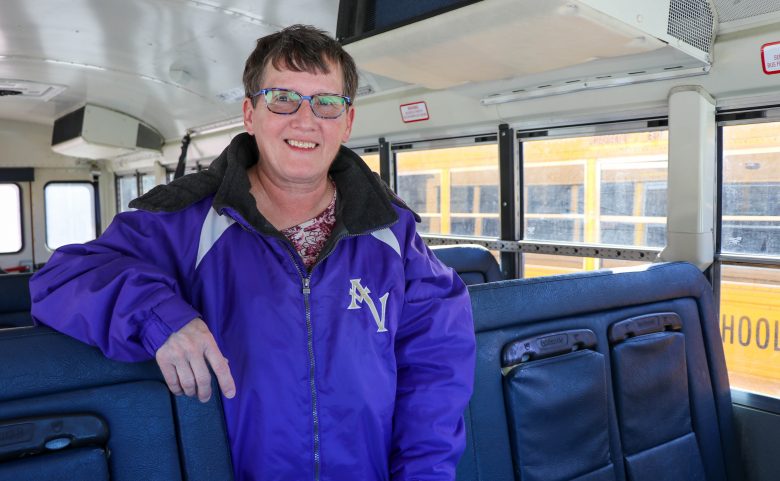 woman standing in school bus