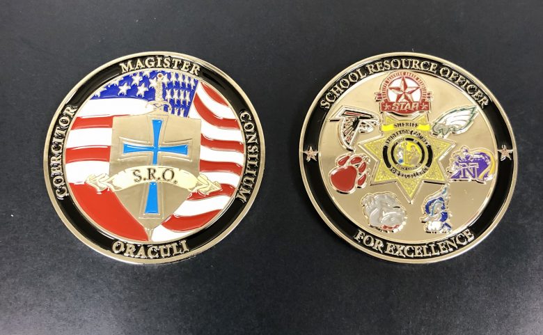 front and back of the SRO challenge coin from the Henderson County Sheriff's Office