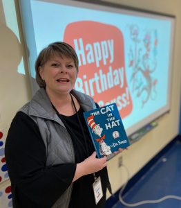 Jan King holding "Cat in the Hat" book