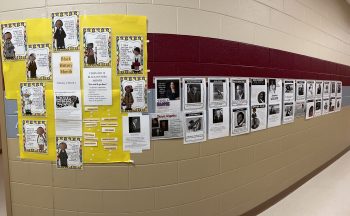 wall of biographies in hallway